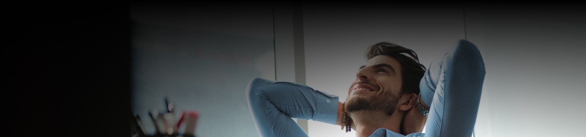 A picture of a person sitting on a chair and enjoying a moment of relaxation.